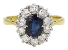 18ct gold oval sapphire and round brilliant cut diamond cluster ring