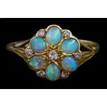 Early 20th century oval opal and diamond flower head cluster ring
