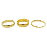 Two 22ct gold wedding bands and an18ct gold wedding band