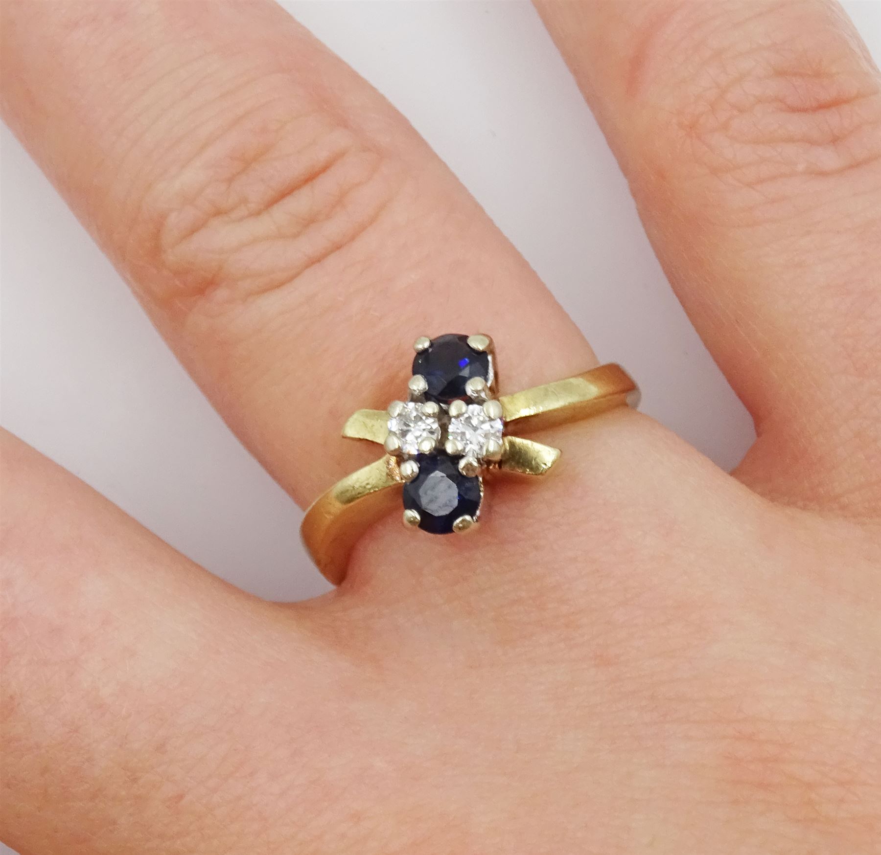 Gold four stone round brilliant cut diamond and sapphire ring - Image 2 of 4