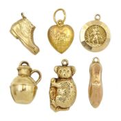 Six 9ct gold charms including koala