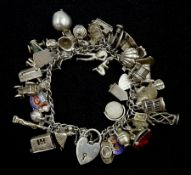 Heavy silver charm bracelet including fly in a spiders web