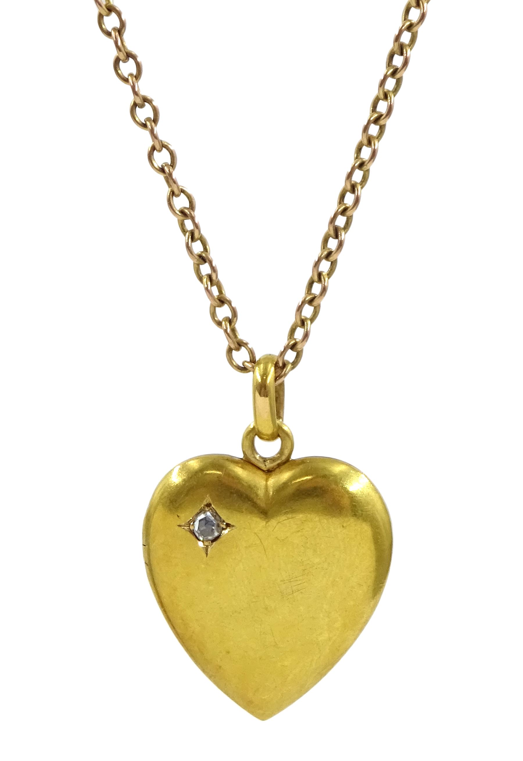 Early 20th century gold heart pendant necklace set with a single stone rose cut diamond