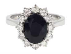 18ct white gold oval sapphire and round brilliant cut diamond cluster ring