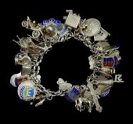 Silver charm bracelet with a large selection of silver charms including car