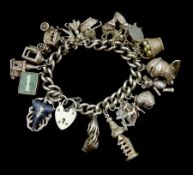 Silver charm bracelet with nineteen charms including poodle