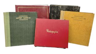 Five albums containing a large quantity of Edwardian and later postcards