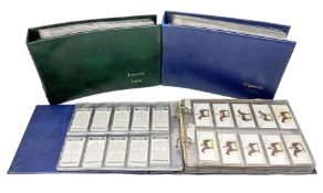 Three modern loose leaf albums containing a large quantity of cigarette and trade cards by Players