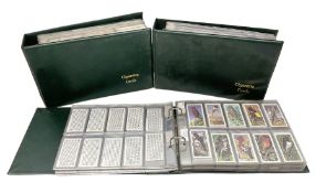 Three modern loose leaf albums containing a large quantity of cigarette and trade cards by Wills