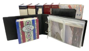 Nine albums containing a large quantity of Edwardian and later postcards