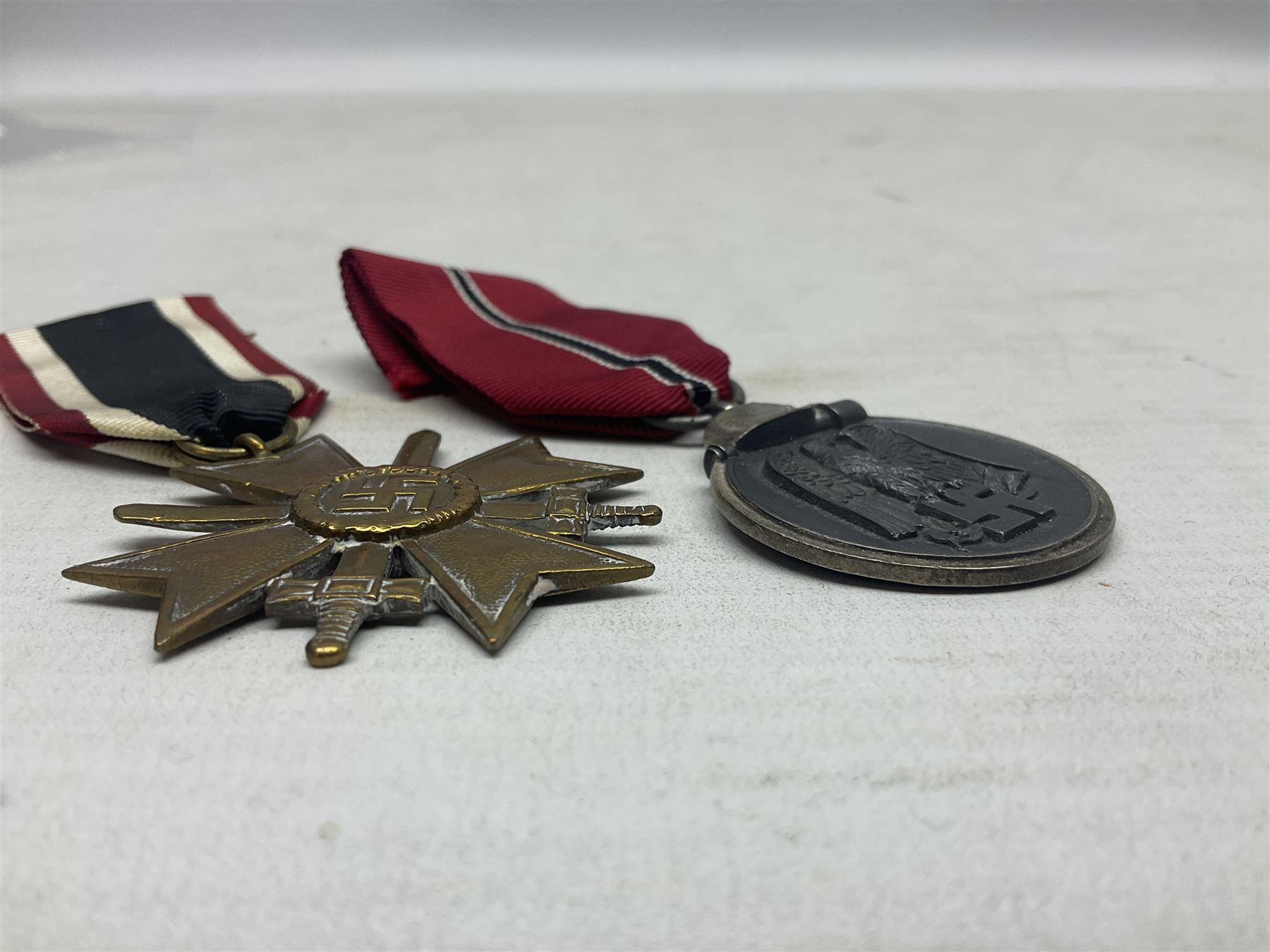 Two WW2 German medals - Winter Campaign in Russia 1941-42 and War merit Cross with swords; both with - Image 7 of 8