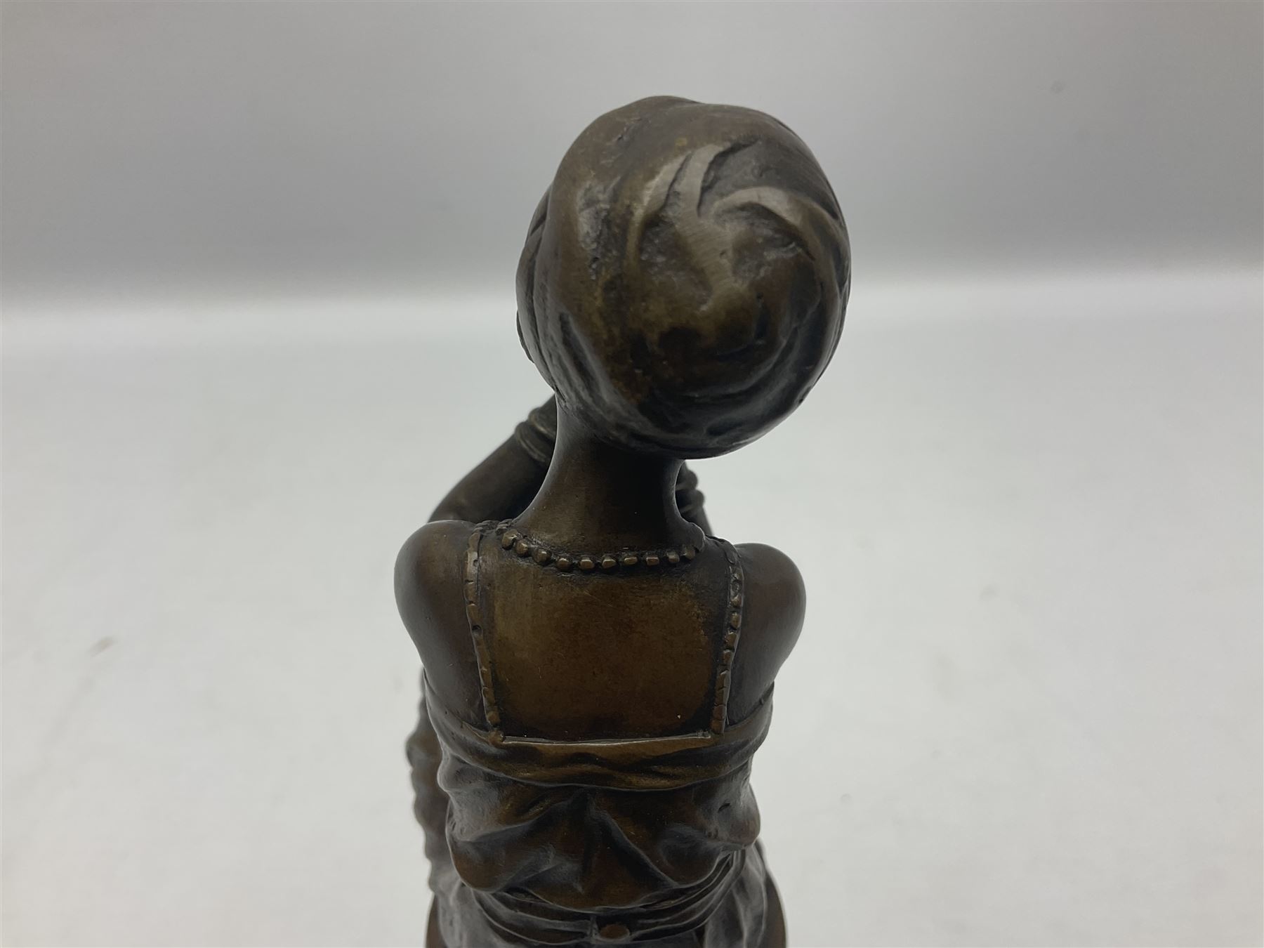Art Deco style bronze figure of a lady seated on a stool applying lipstick - Image 4 of 7