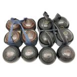 Twelve lawn green bowling balls