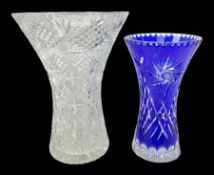 Heavy bohemian blue overlaid cut glass vase of waisted form with hobstar decoration and star cut bas