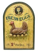 Painted wood panelled sign moulded with a hen titled Fresh Eggs in green lettering