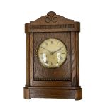 German striking mantle clock in an oak case by the Hamburg and American Clock company