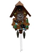 Battery operated cuckoo clock in a traditional chalet styled case with dummy weights