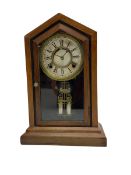 Late 19th century American shelf clock in a mahogany case with a fully glazed door on a stepped plin