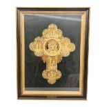 Cork carving of a religious cross depicting intricate scenes of various religious figures and motifs