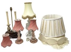 Quantity of table lamps to include pair of pink and gilt glass examples with pink pleated fabric sha