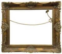 Frame: 20th century ornate gilt swept frame aperture 50cm x 60cm