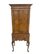 Queen Anne style figured walnut drinks cabinet on stand