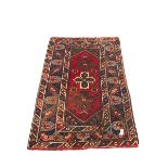 Persian red and blue ground rug