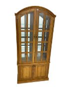 Light oak arched top display cabinet