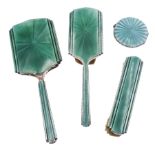 1930's three piece silver mounted and green guilloche enamel dressing table set