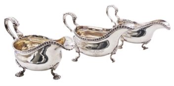 Set of three George III silver sauce boats