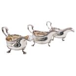 Set of three George III silver sauce boats