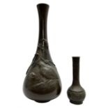 Late 19th/early 20th century Japanese bronze vase of slender baluster form with flared neck
