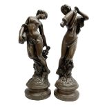 Pair of bronzed figures of water carriers