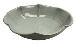 Jeremy Leach (British 1941-): Celadon glazed stoneware bowl of fluted circular form