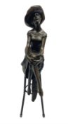 Art Deco style bronze modelled as a female figure seated cross legged upon a chair