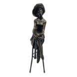 Art Deco style bronze modelled as a female figure seated cross legged upon a chair