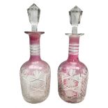 Pair of late 19th/early 20th century cranberry flash cut glass decanters