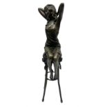 Art Deco style bronze modelled as a female figure seated upon a chair