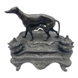 Bronze inkwell modelled in the form of a greyhound upon a naturalistic base