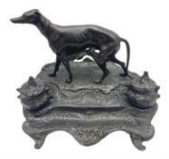 Bronze inkwell modelled in the form of a greyhound upon a naturalistic base