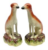 Pair of Staffordshire style seated greyhounds