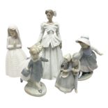 Three Nao figures comprising The Next Dance 1201 and Girls First Communion 0236