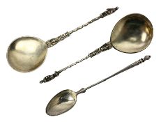 Silver spoon with elongated stem and engraved detail