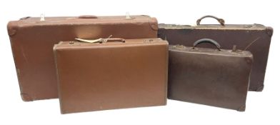 Four vintage leather brown suitcases