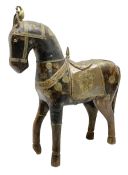 Wooden horse with a copper and brass saddle and decoration