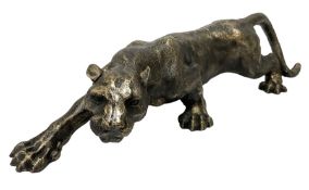Cast metal figure modelled as a cougar in crouching pose