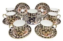 Set of six Royal Crown Derby Imari 2451 pattern coffee cans and saucers