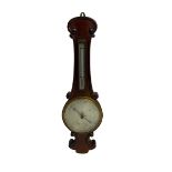 Early 20th century aneroid barometer c1910 in a scroll carved mahogany case with a silvered dial