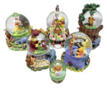 Four Disney Winnie The Pooh snow globes