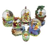 Four Disney Winnie The Pooh snow globes